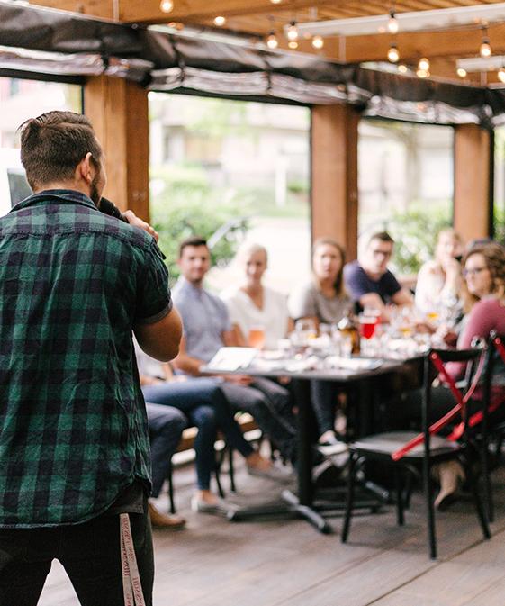 Person Presenting to an Audience at an Event